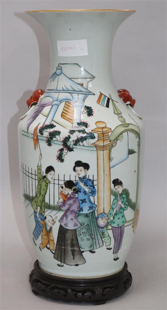 A Chinese famille rose baluster vase, wood stand height 42cm